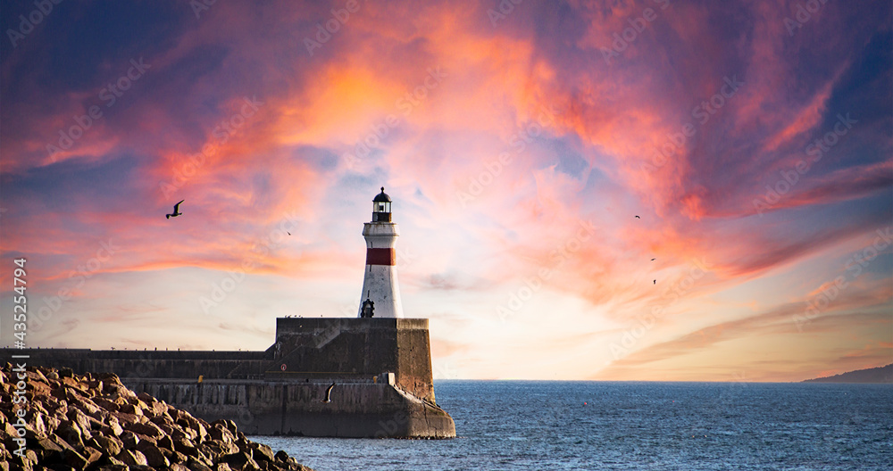 Sunrise at Freaerburgh  Lighthouse, Aberdeenshire, Scotland, UK.Fraserburgh Harbour is situated in Aberdeenshire in the North-East corner of Scotland and is ideally positioned for the fishing grounds  - obrazy, fototapety, plakaty 