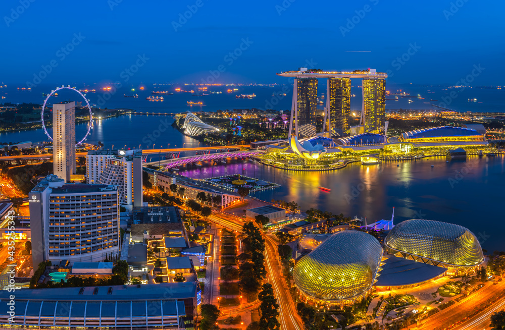 The bird's-eye view at Singapore cityscape around Marina bay and Modern high building in business district area at twilightis one of Singapore's most beautiful highlights.