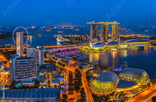 Photography The bird's-eye view at Singapore cityscape around Marina bay and Modern high building in business district area at twilightis one of Singapore's most beautiful highlights