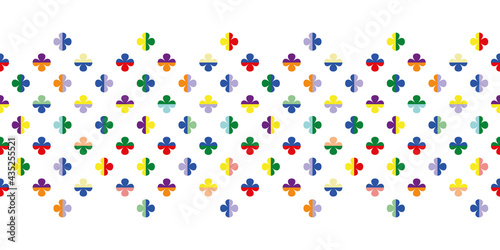 Seamless vector pattern border with four leaf clover symbols in rainbow colours. Regularly repeating geometric flower shapes for fabrics, prints and themed stationery.