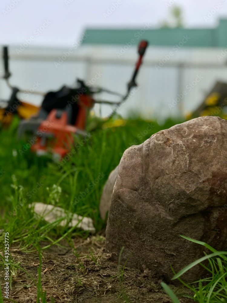 Naklejka premium mowing the grass