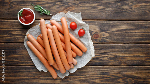 Vienna sausages. Wooden background.Top view with copy space for text.