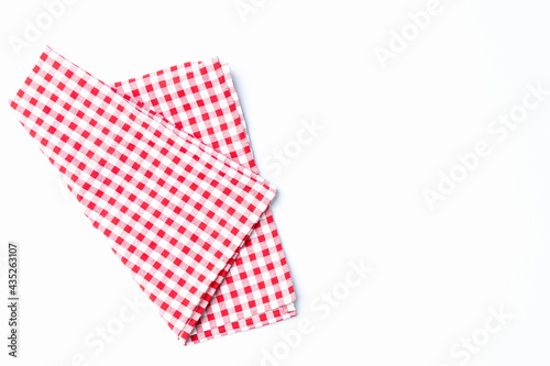 Top view napkin checkers red and white place on a white background. Fabric red and white Isolated with copy space.