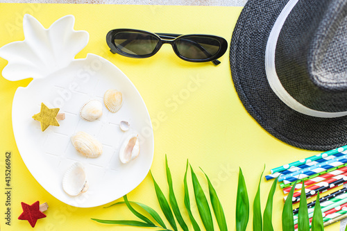 summer background palm straw hat, sunglasses tropical leaf relax accessories summer vacation positive mood vacation top view