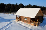 Wooden house in winter. Newly built house. Winter landscape. View from above.