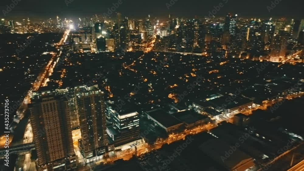 Slow motion illuminated night cityscape panorama aerial view. Skyscrapers towers at traffic roads. Downtown illuminate streets with modern buildings. Urban nightlife lifestyle. Shanghai, China, Asia Slow motion illuminated night cityscape panorama aerial view. Skyscrapers towers at traffic roads. Downtown illuminate streets with modern buildings. Urban nightlife lifestyle. Shanghai, China, Asia