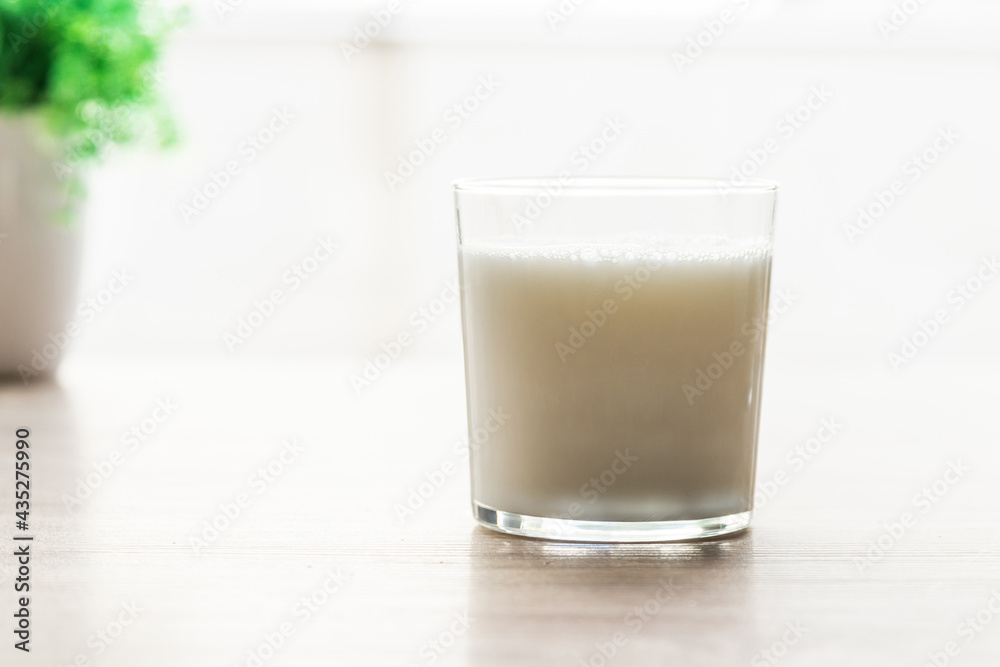 glass of natural milk on the table glass of natural milk on the table