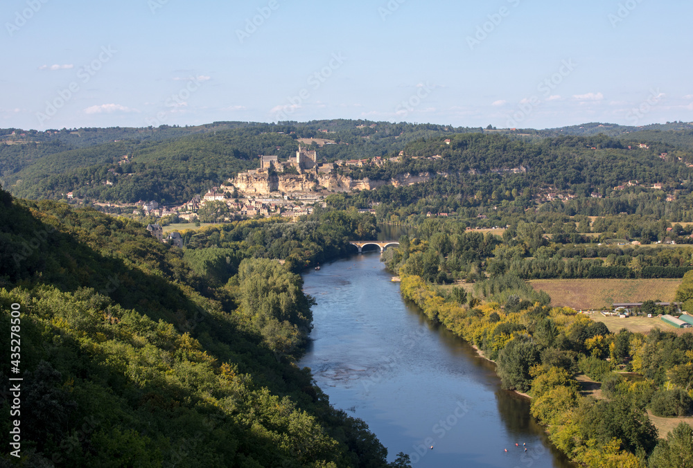 Beynac et Cazenac, France - September 4, 2018: The medieval Chateau de Beynac rising on a limestone cliff above the Dordogne River seen from Castelnaud. France, Dordogne department, Beynac-et-Cazenac
