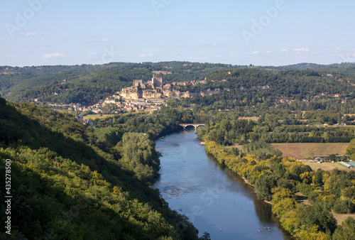 Beynac et Cazenac, France - September 4, 2018: The medieval Chateau de Beynac rising on a limestone cliff above the Dordogne River seen from Castelnaud. France, Dordogne department, Beynac-et-Cazenac