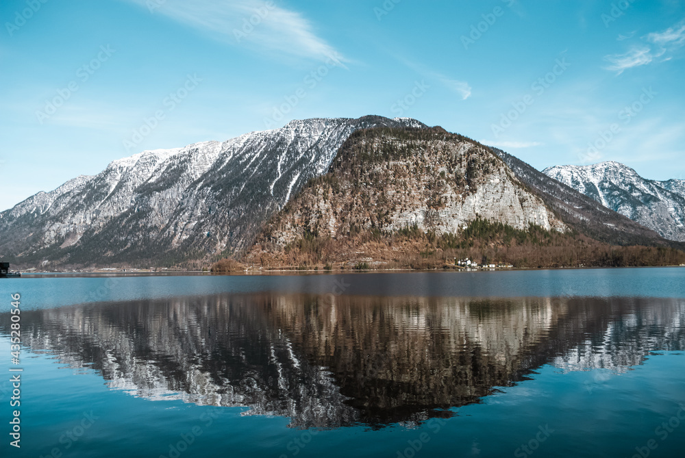 Mountain reflected in the lake in a sunny day
