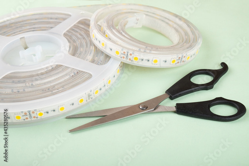 led strip and scissors for installing decorative light. photo