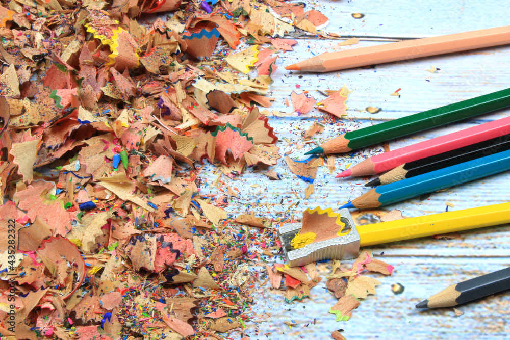 Colored pencils along with wood chip Colored pencils along with wood chip