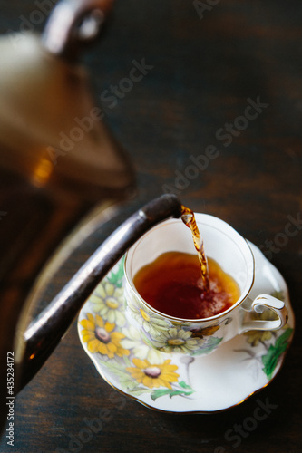Tea being poured from teapot 