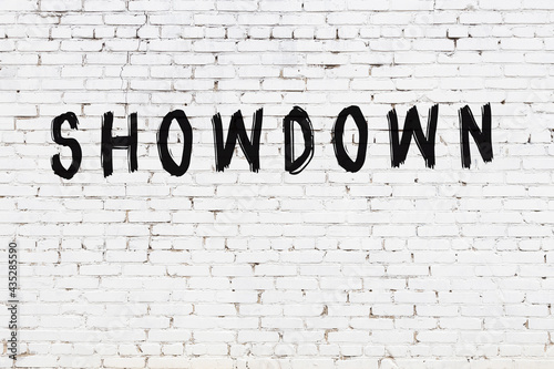 Vászonkép Inscription showdown painted on white brick wall