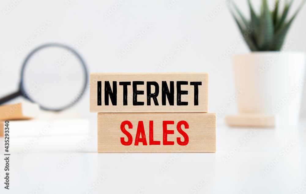 wooden block text internet sales, working from home concept. wooden block text internet sales, working from home concept.