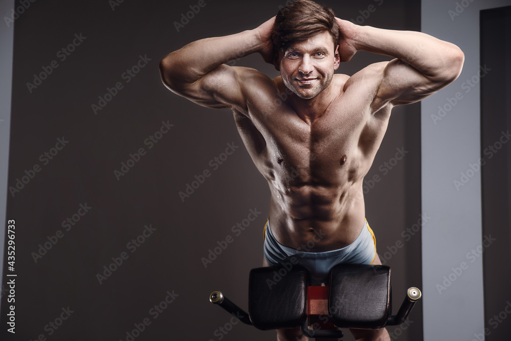 athletic man exercising pumping up muscles athletic man exercising pumping up muscles