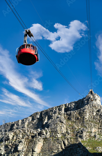 Table mountain red cable car with a view towards the top cable way station - Great outdoors adventure and travel holiday destination, Cape Town, South Africa
