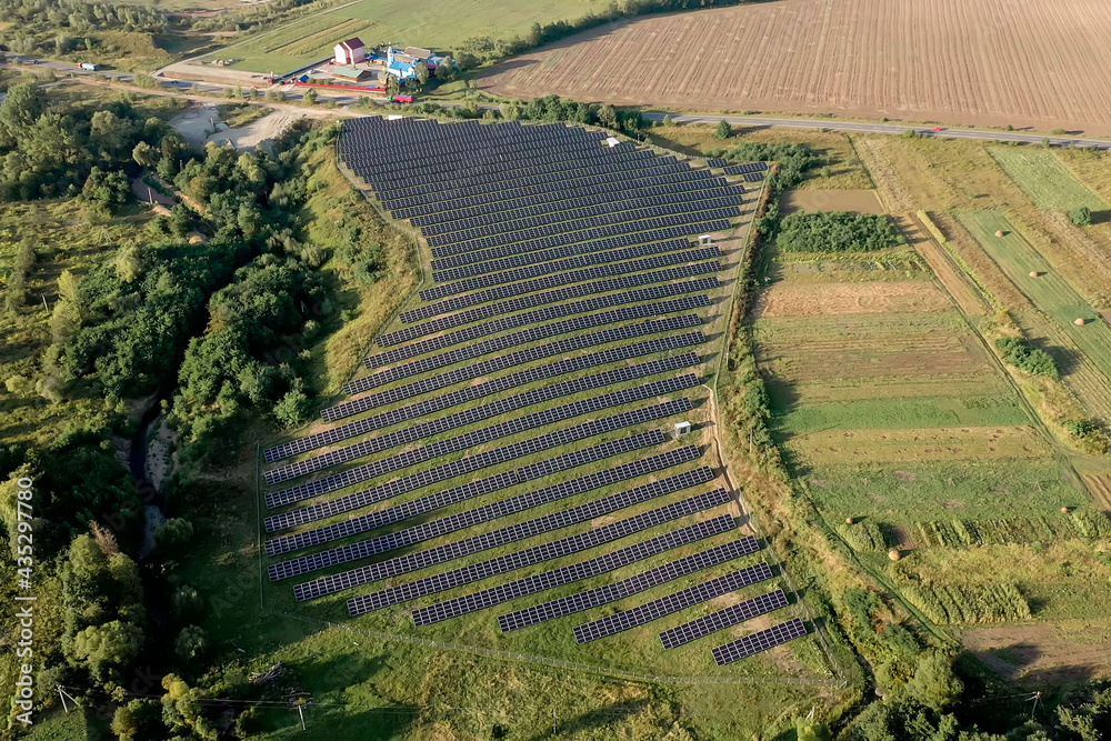 Solar panels in aerial view. power farm producing clean energy.