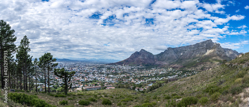 Table mountain panorama with white fluffy clouds. Great outdoors adventure and travel holiday destination, Cape Town, South Africa