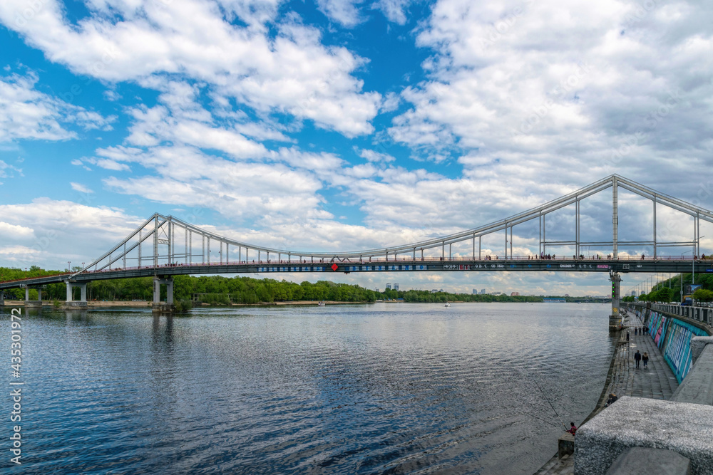 Pedestrian bridge and embankment of the Dnieper river in Kiev, Ukraine	