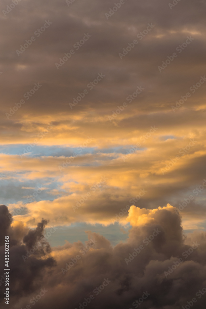 Spring sky at dusk with clouds of abstract shapes. Can be used as wallpaper or background of other projects
