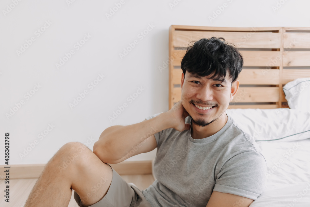 Asian man relax in his apartment while in quarantine stay at home. Asian man relax in his apartment while in quarantine stay at home.