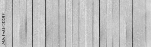 Panorama of New White vintage wooden wall texture and background seamless or a white wooden fence