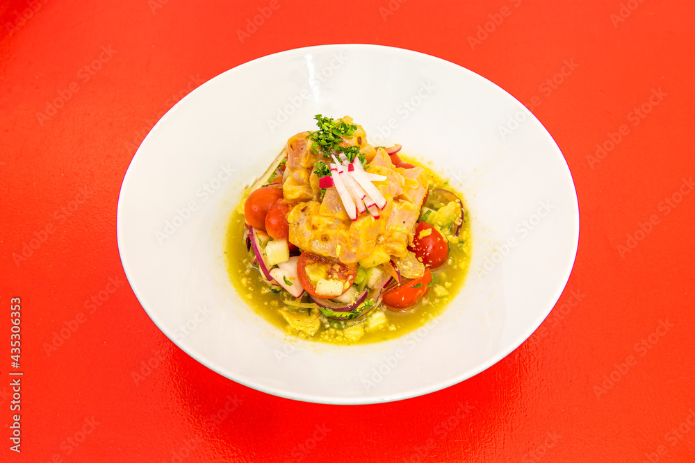 Mexican-style fish ceviche with cherry tomatoes, red onion, radishes Mexican-style fish ceviche with cherry tomatoes, red onion, radishes