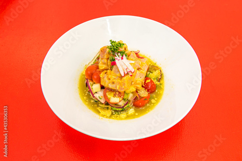 Mexican-style fish ceviche with cherry tomatoes, red onion, radishes