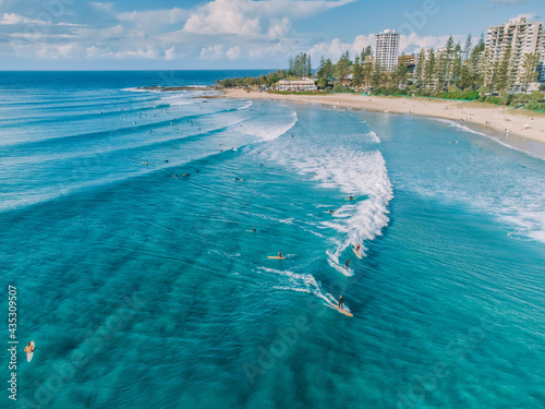 An aerial view of surfers and swimmers at Rainbow Bay, Gold Coast, Australia photo