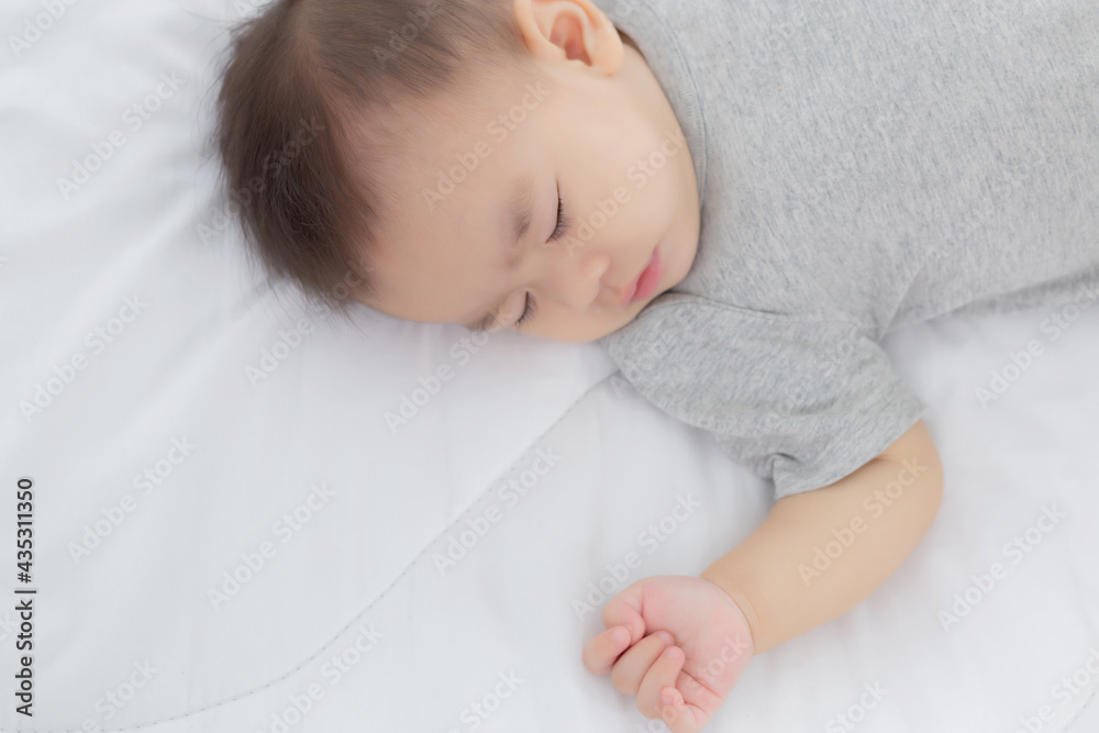 Portrait of asian little baby girl sleeping on bed in the bedroom at home, newborn napping with cozy and relax, infant innocence in bedtime, happy toddler cute, growth of child and emotion, indoors. Portrait of asian little baby girl sleeping on bed in the bedroom at home, newborn napping with cozy and relax, infant innocence in bedtime, happy toddler cute, growth of child and emotion, indoors.