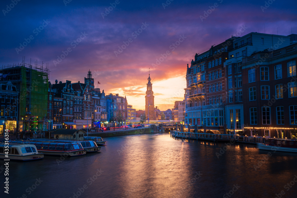 Amsterdam Cityscape with Mint Tower over Amstel River with Colorful Sunset, Holland, Netherlands