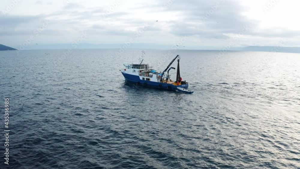 Fishing Boat Travelling Back In The Port of Rijeka In Croatia. aerial Fishing Boat Travelling Back In The Port of Rijeka In Croatia. aerial