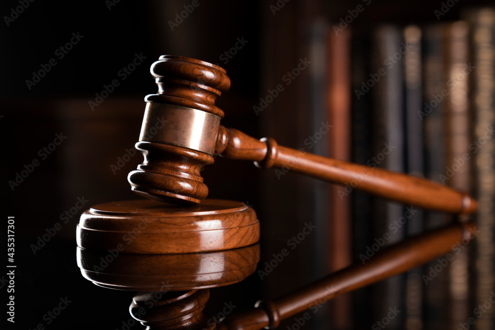 Law theme. Judge chamber. Judge’s gavel and collection of legal books in the bookshelf. Law theme. Judge chamber. Judge’s gavel and collection of legal books in the bookshelf.
