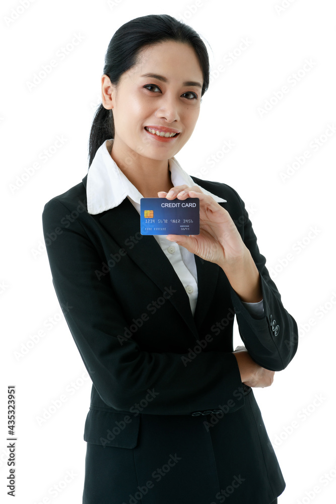 Portrait closeup isolated cut out shot of Asian happy beautiful friendly successful female businesswoman wears black formal suit standing hold blue credit card in hand in front of white background Portrait closeup isolated cut out shot of Asian happy beautiful friendly successful female businesswoman wears black formal suit standing hold blue credit card in hand in front of white background