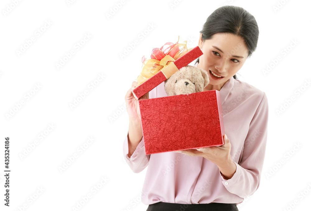 Portrait closeup isolated cut out shot of young happy Asian female housewife stand smiling open and hold cover of red birthday celebration present gift box of teddy bear doll from husband in hands Portrait closeup isolated cut out shot of young happy Asian female housewife stand smiling open and hold cover of red birthday celebration present gift box of teddy bear doll from husband in hands