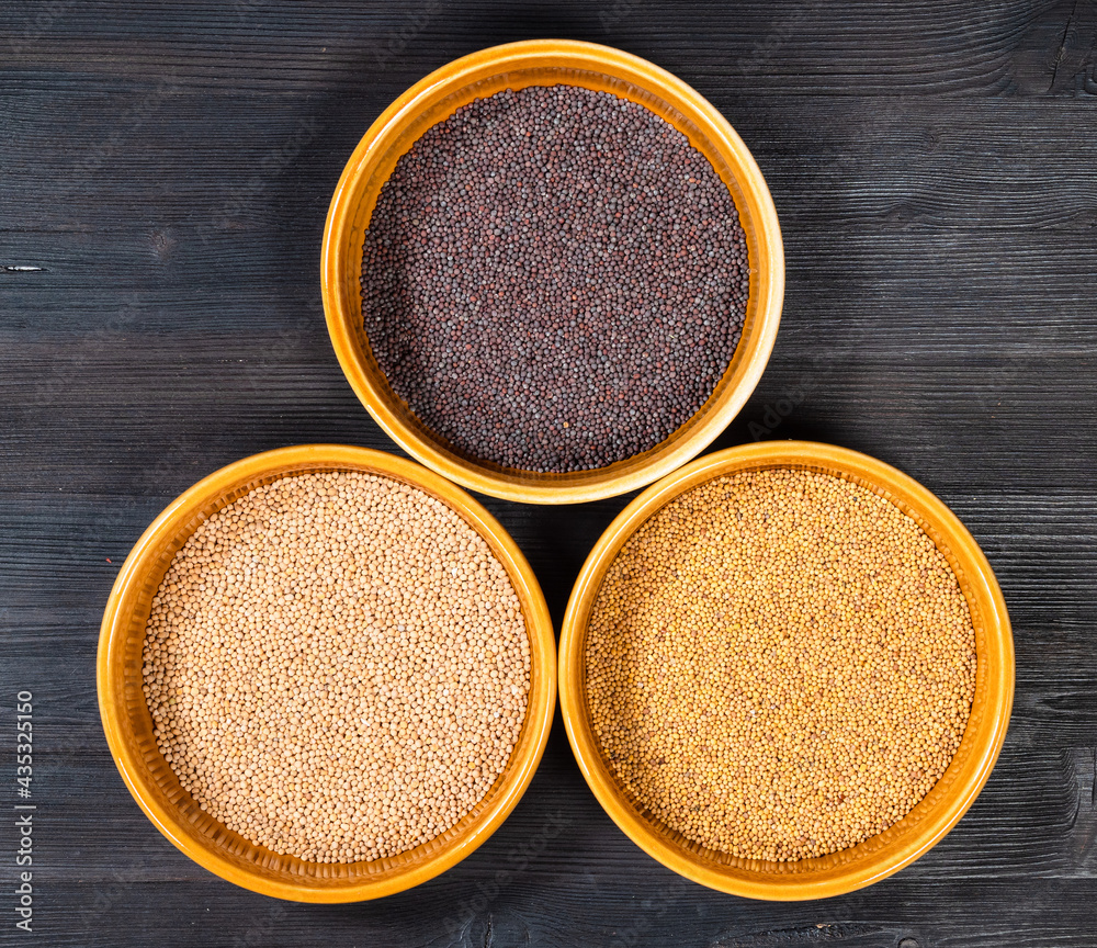 top view of bowl with various mustard seeds top view of bowl with various mustard seeds