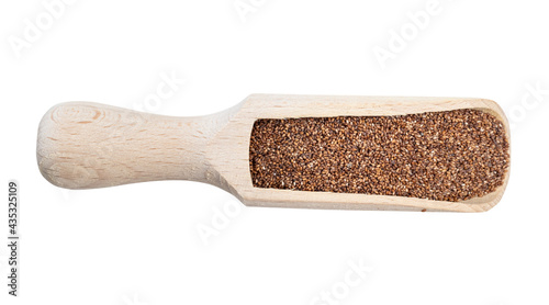 wholegrain teff seeds in wood scoop cutout photo