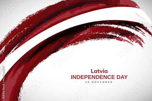 Happy independence day of Latvia with watercolor brush stroke flag background with abstract watercolor grunge brush flag