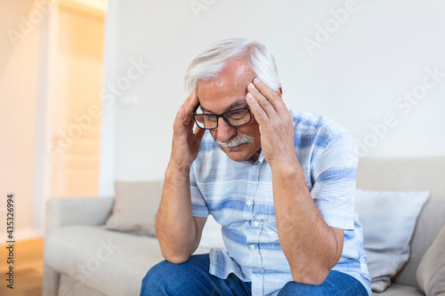 Wallpaper Mural Attack of the monster migraine. Unhappy Retired Senior man holding his head with pain expression . Face of senior man suffering from headache Torontodigital.ca