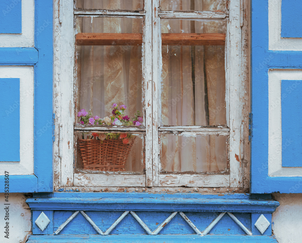 Window from Old Vintage Rustic Wooden Natural Surface Planks with Flowers on the Windowsill.