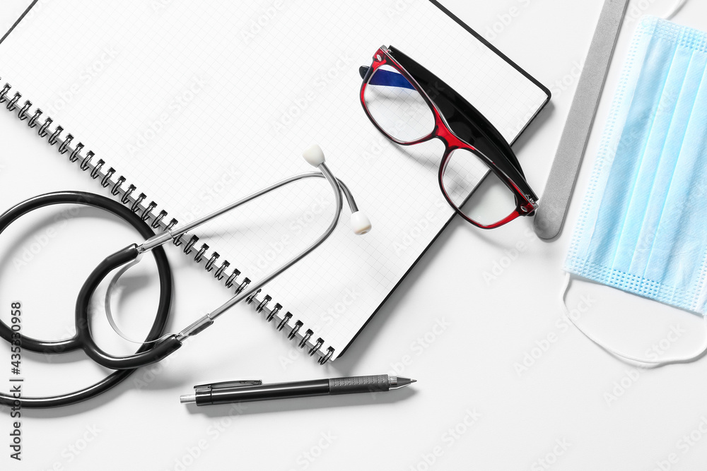 Composition with modern stethoscope on light background Composition with modern stethoscope on light background