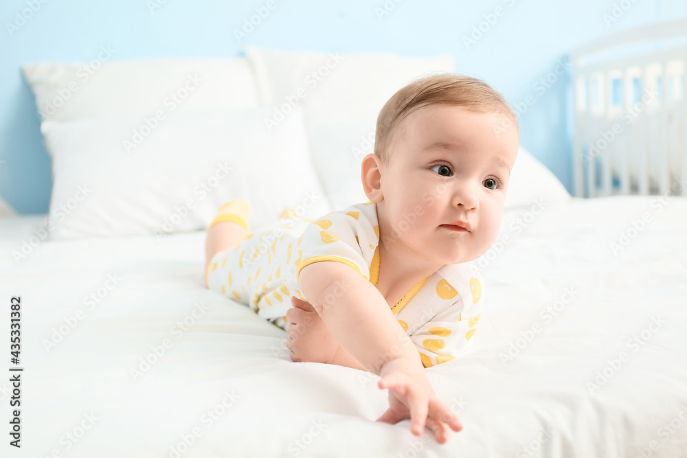 Cute little baby lying on bed, closeup
