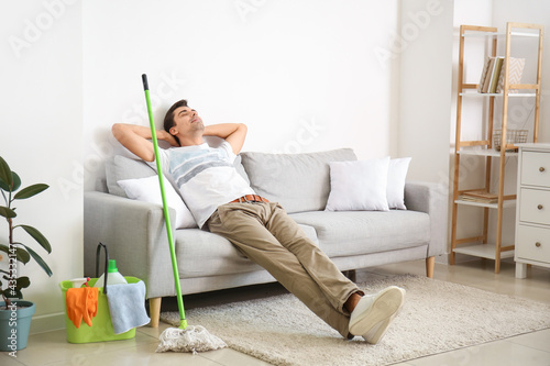 Young man with cleaning sup...