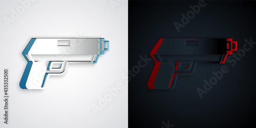 Paper cut Pistol or gun icon isolated on grey and black background. Police or military handgun. Small firearm. Paper art style. Vector