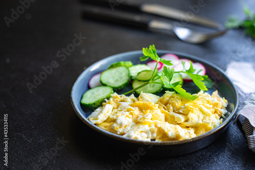 scrambled fried eggs scrumble fresh breakfast organic, wholesome dish on the table healthy food meal snack copy space food background rustic. top view keto or paleo diet photo