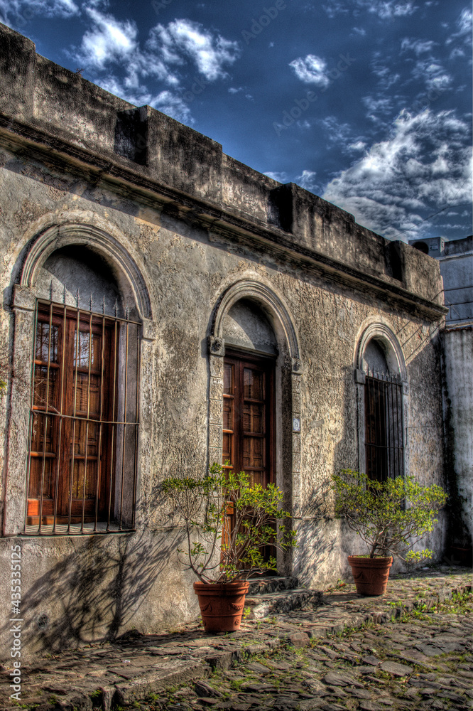 Beautiful old house with plants in front. Colonia del Sacramento, Uruguay. Beautiful old house with plants in front. Colonia del Sacramento, Uruguay.