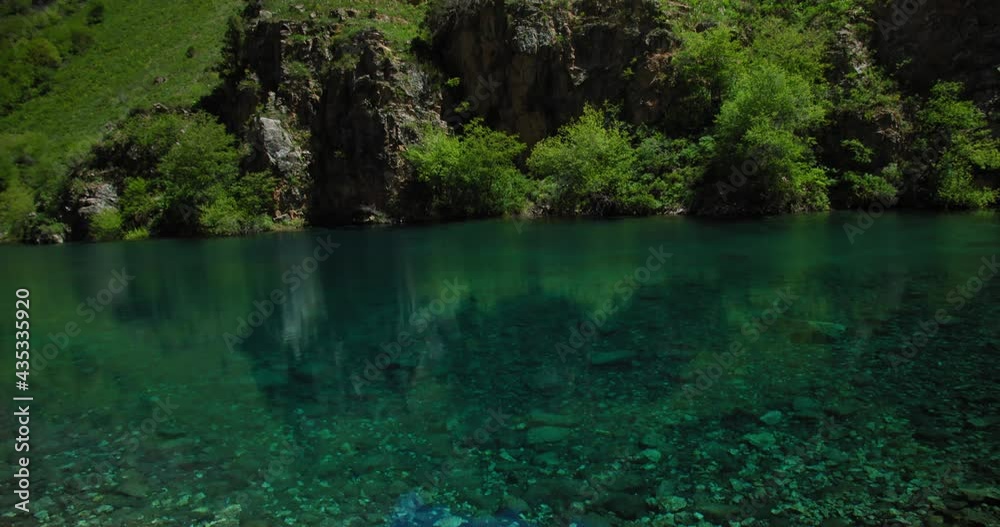 Small Mountain Lake of blue color Urungach. Located in Uzbekistan, Central Asia. 4 out of 10 Small Mountain Lake of blue color Urungach. Located in Uzbekistan, Central Asia. 4 out of 10
