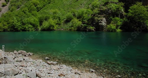 Small Mountain Lake of  blue color Urungach. Located in Uzbekistan, Central Asia. 2 out of 10 photo