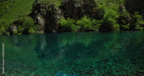 Small Mountain Lake of  blue color Urungach. Located in Uzbekistan, Central Asia. 4 out of 10 photo